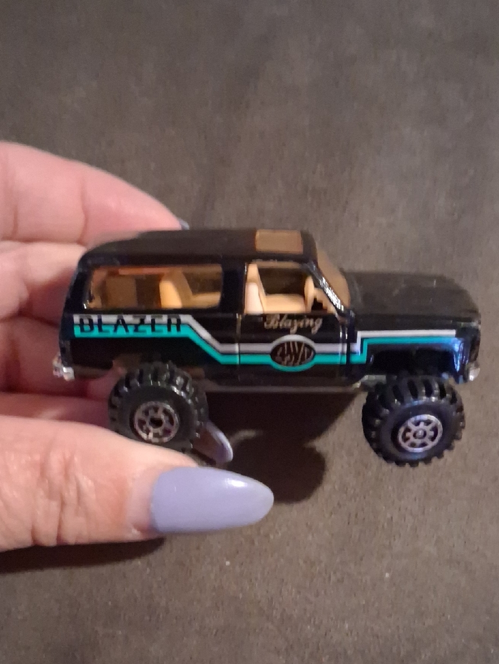 Black Toy Blazer Monster Truck with Teal Stripe